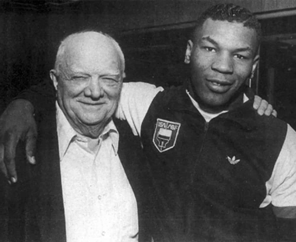 Young Mike Tyson in Sports Jacket with Coach